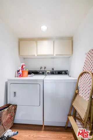 a living room with lots of furniture and kitchen view