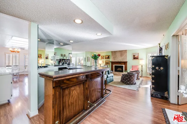 a kitchen with a sink cabinets and stainless steel appliances