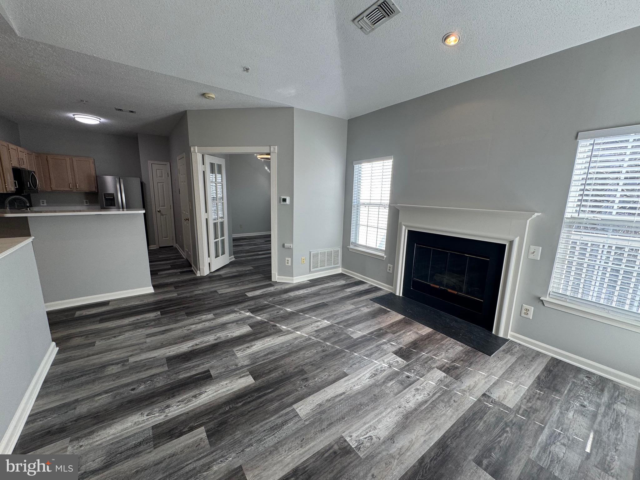 1716 Lake Shore Crest Drive, Unit 32 Reston, VA 20190 - Photo 12 of 40 a view of a livingroom with a fireplace