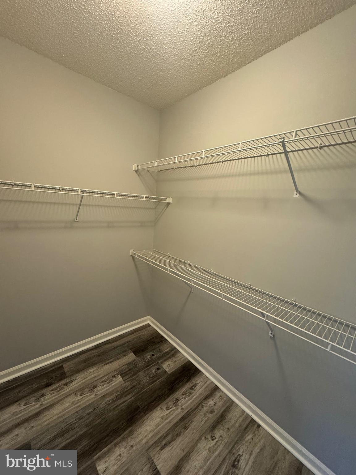 1716 Lake Shore Crest Drive, Unit 32 Reston, VA 20190 - Photo 17 of 40 a view of a room with racks on the wall