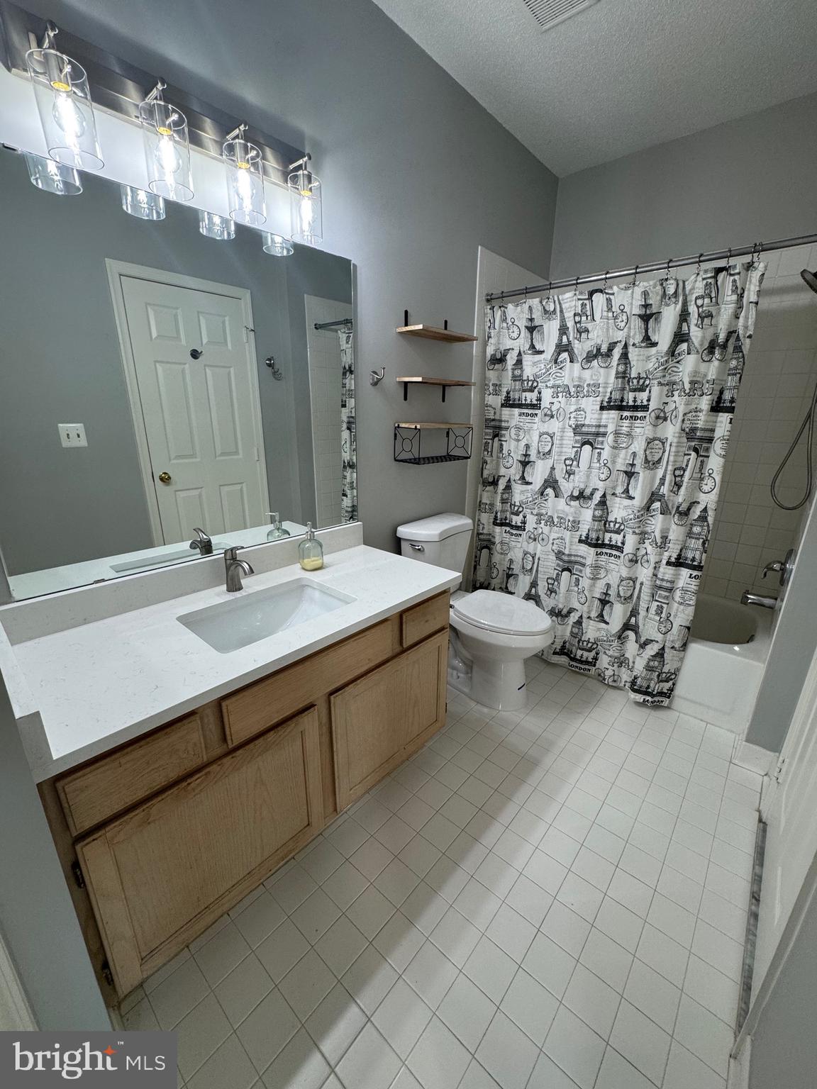 1716 Lake Shore Crest Drive, Unit 32 Reston, VA 20190 - Photo 18 of 40 a bathroom with a sink mirror and toilet