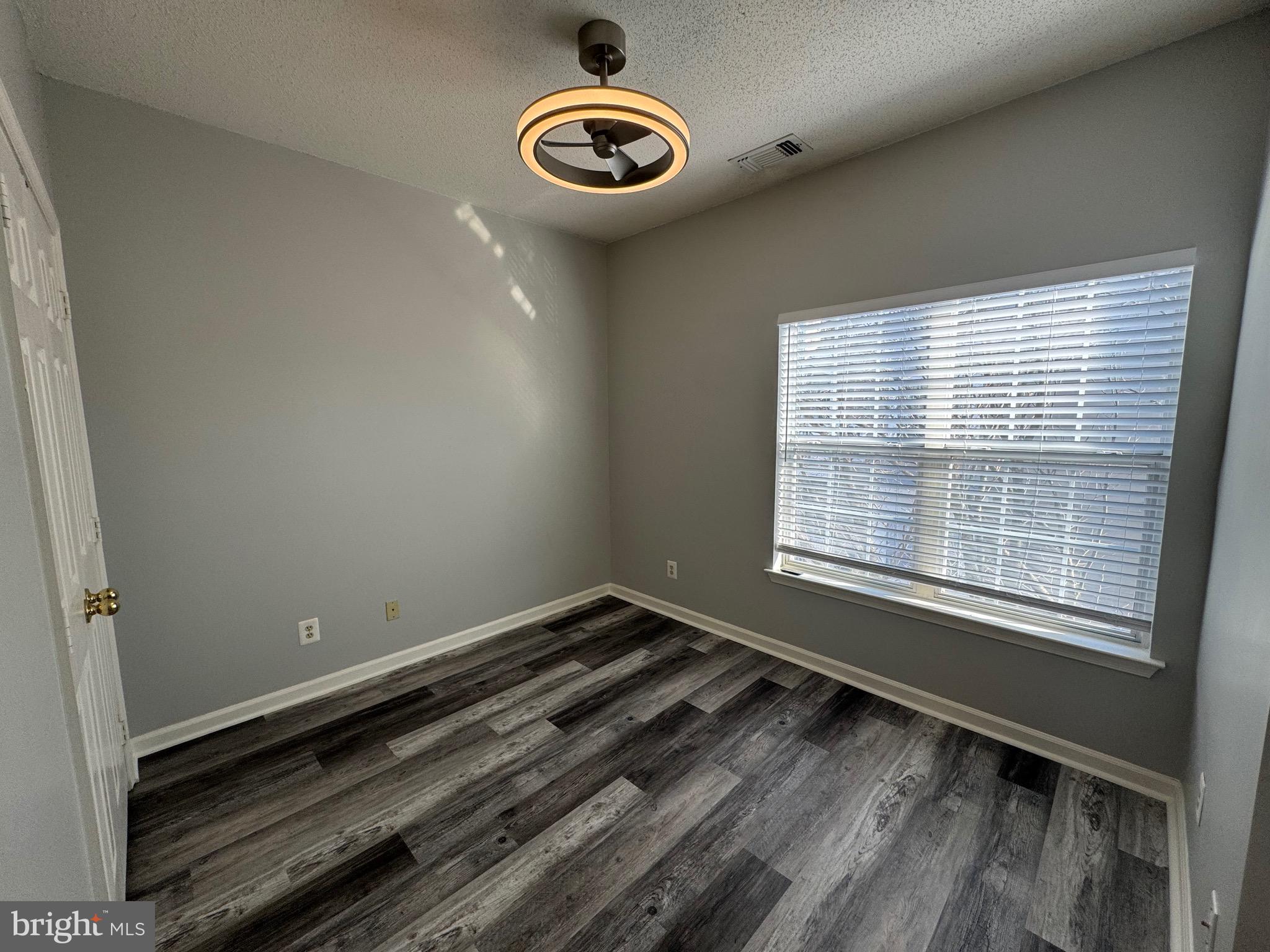 1716 Lake Shore Crest Drive, Unit 32 Reston, VA 20190 - Photo 21 of 40 a view of a room with rack on the wall and a window