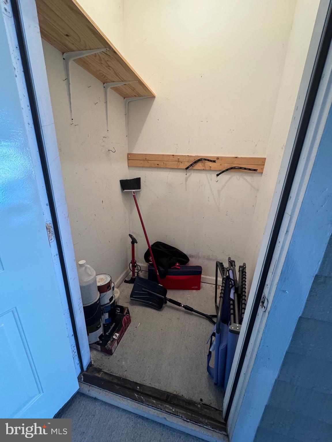 1716 Lake Shore Crest Drive, Unit 32 Reston, VA 20190 - Photo 32 of 40 a view of storage and utility room with clothes water heater and stairs