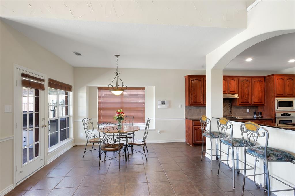 10414 Broadmoor Lane Rowlett, TX 75089 - Photo 9 of 38 Dining space with dark tile patterned floors and recessed lighting