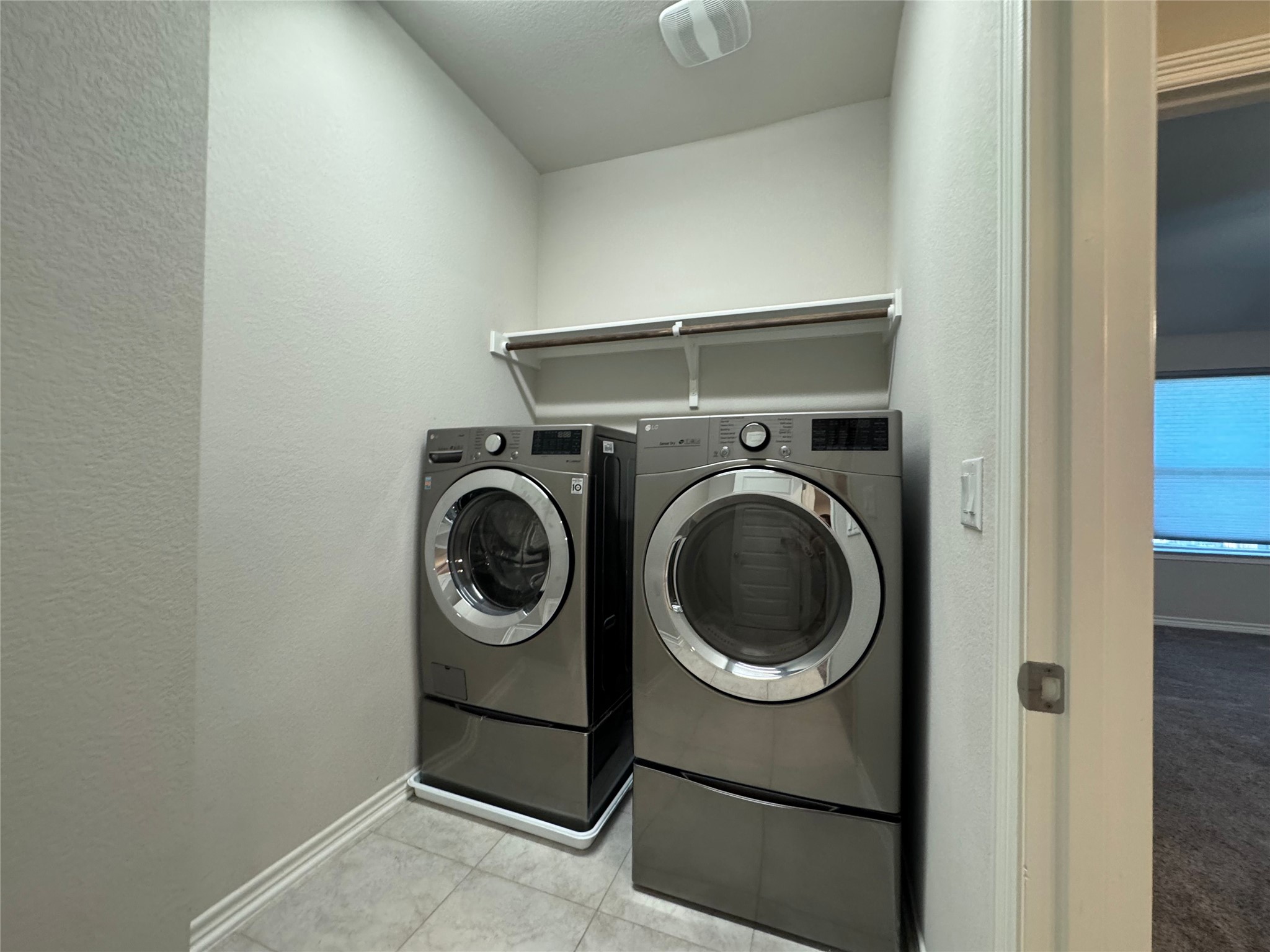 14100 McCoy Loop, Unit 1 Austin, TX 78717 - Photo 34 of 39 Functional laundry nook provides practical space for household chores with modern appliances.