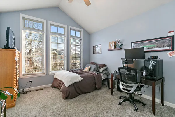 a bathroom with a sink a toilet a shower curtain and a mirror