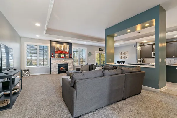 a living room with furniture and a fireplace