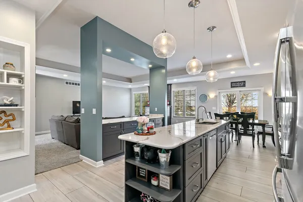 a kitchen with stainless steel appliances a sink stove and cabinets