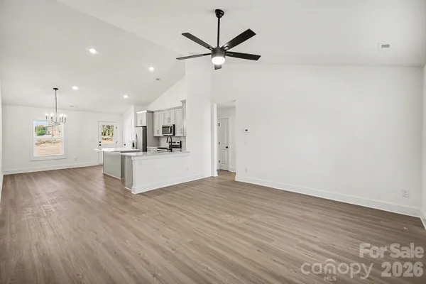 a view of kitchen with cabinets and wooden floor