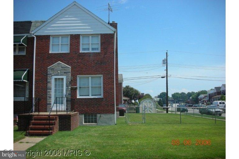 1919 Church Road Baltimore, MD 21222 - Photo 1 of 1 a front view of a house with a garden