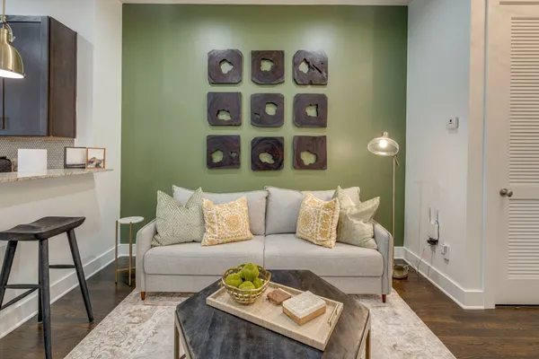 a living room with furniture and a flat screen tv