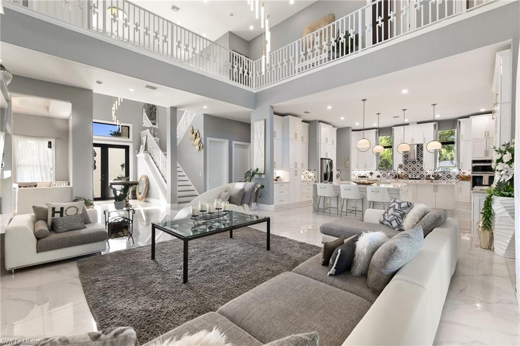 2227 21st Street Southwest Naples, FL 34117 - Photo 11 of 50 a living room with furniture and view of kitchen
