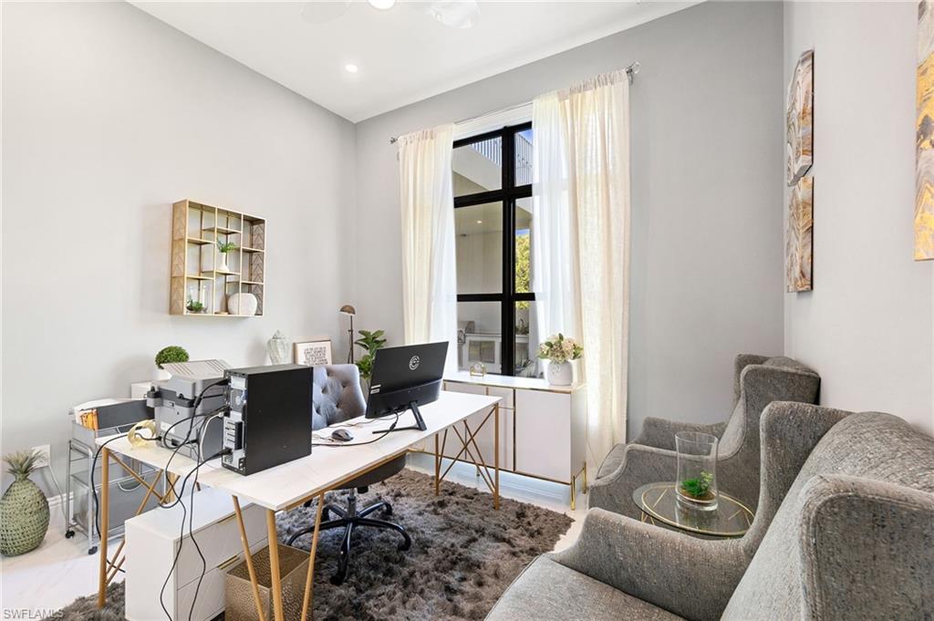 2227 21st Street Southwest Naples, FL 34117 - Photo 19 of 50 a living room with furniture and wooden floor
