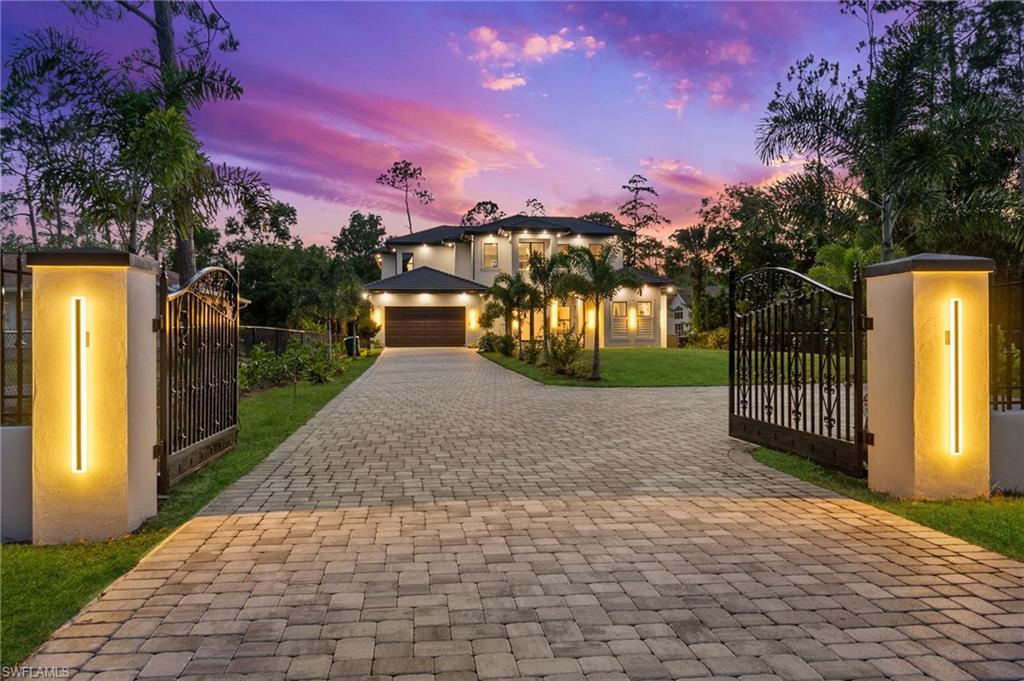 2227 21st Street Southwest Naples, FL 34117 - Photo 2 of 50 a view of a yard with plants and trees