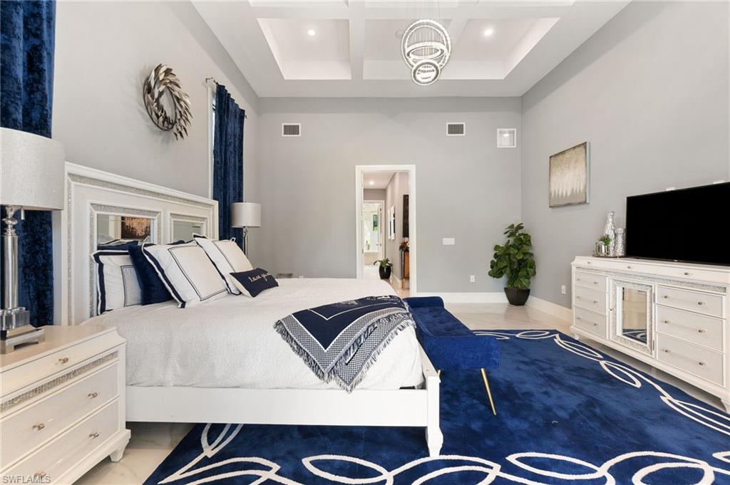 2227 21st Street Southwest Naples, FL 34117 - Photo 21 of 50 a living room with furniture fireplace and flat screen tv