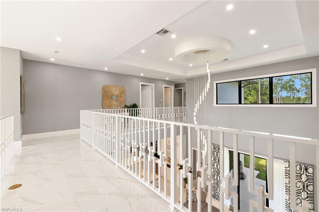 2227 21st Street Southwest Naples, FL 34117 - Photo 30 of 50 a view of a hallway with window and stairs