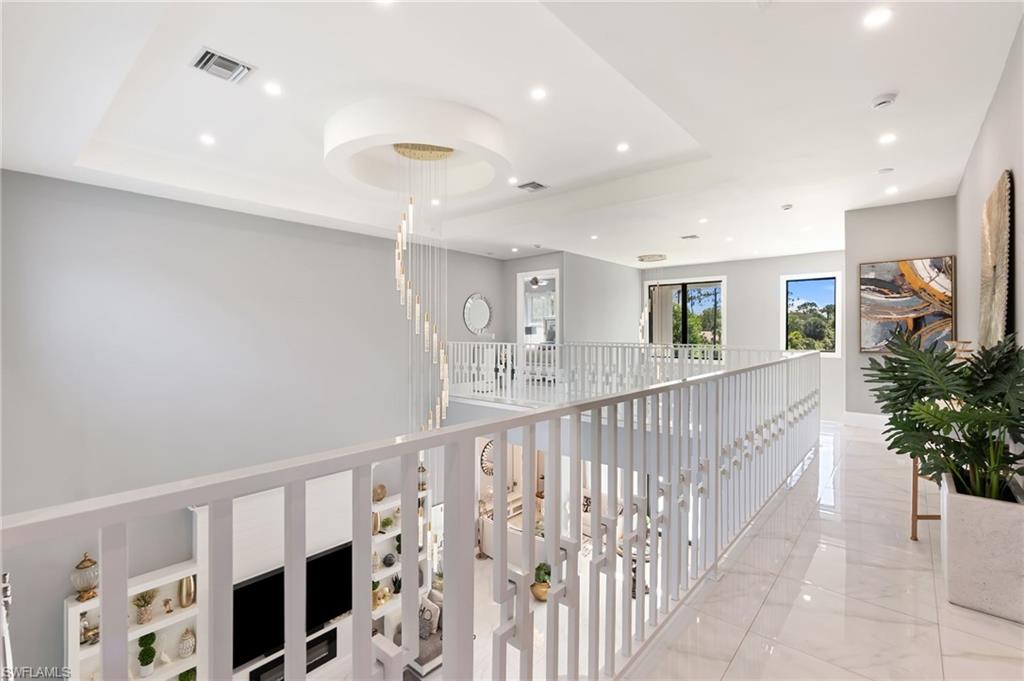 2227 21st Street Southwest Naples, FL 34117 - Photo 31 of 50 a view of entryway with wooden floor