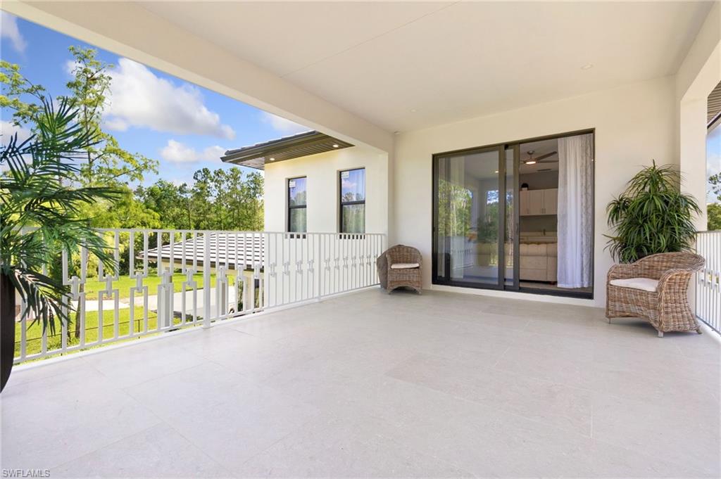 2227 21st Street Southwest Naples, FL 34117 - Photo 39 of 50 a view of an chairs and tables in the balcony