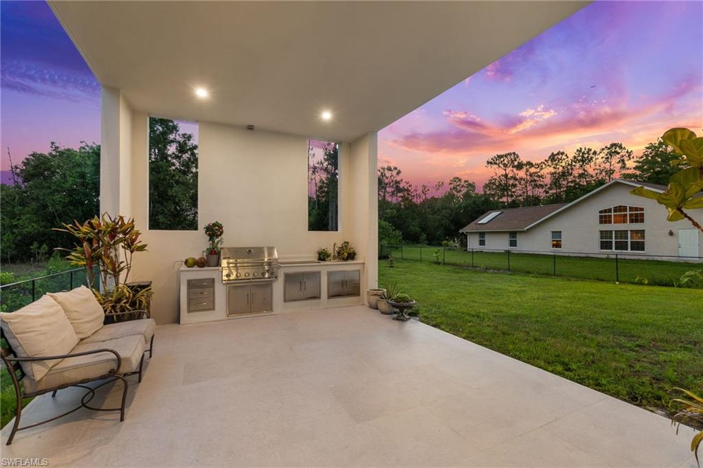 2227 21st Street Southwest Naples, FL 34117 - Photo 42 of 50 a view of a house with backyard and sitting area