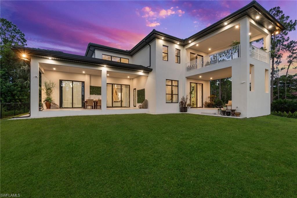 2227 21st Street Southwest Naples, FL 34117 - Photo 46 of 50 a view of a house with a yard