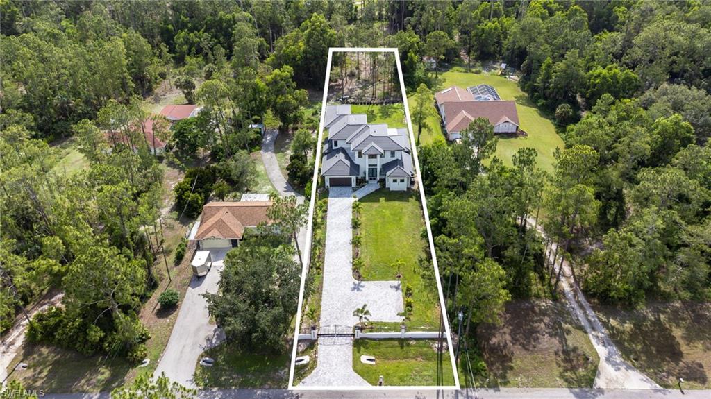 2227 21st Street Southwest Naples, FL 34117 - Photo 47 of 50 an aerial view of house with swimming pool