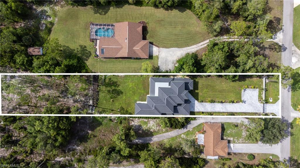 2227 21st Street Southwest Naples, FL 34117 - Photo 49 of 50 an aerial view of house with yard swimming pool and outdoor seating