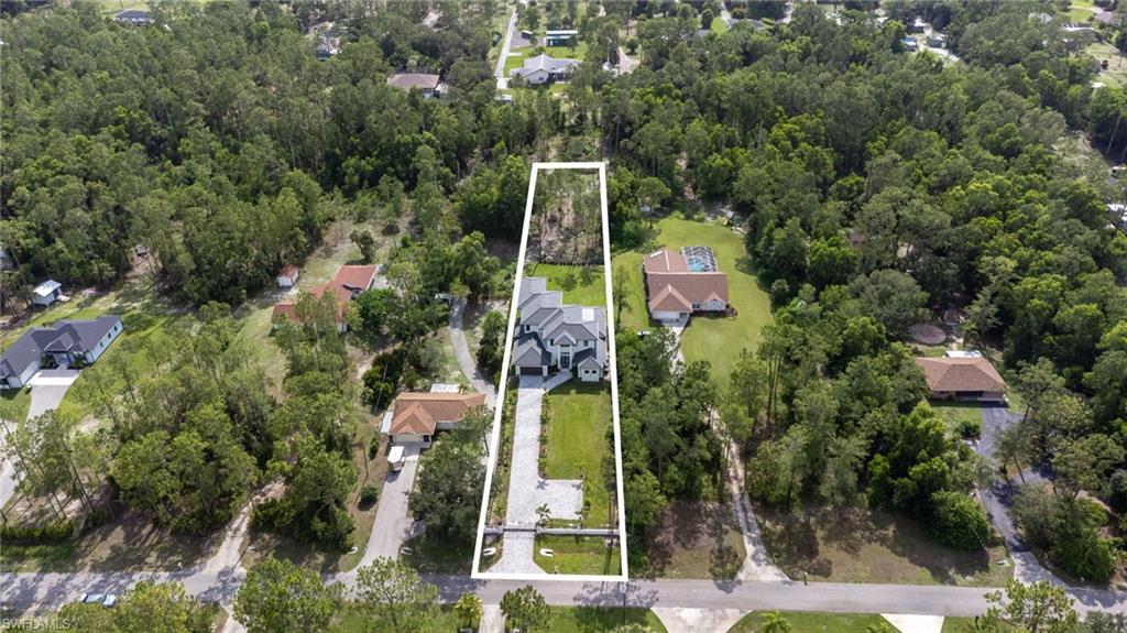 2227 21st Street Southwest Naples, FL 34117 - Photo 50 of 50 an aerial view of a house with a yard and fountain