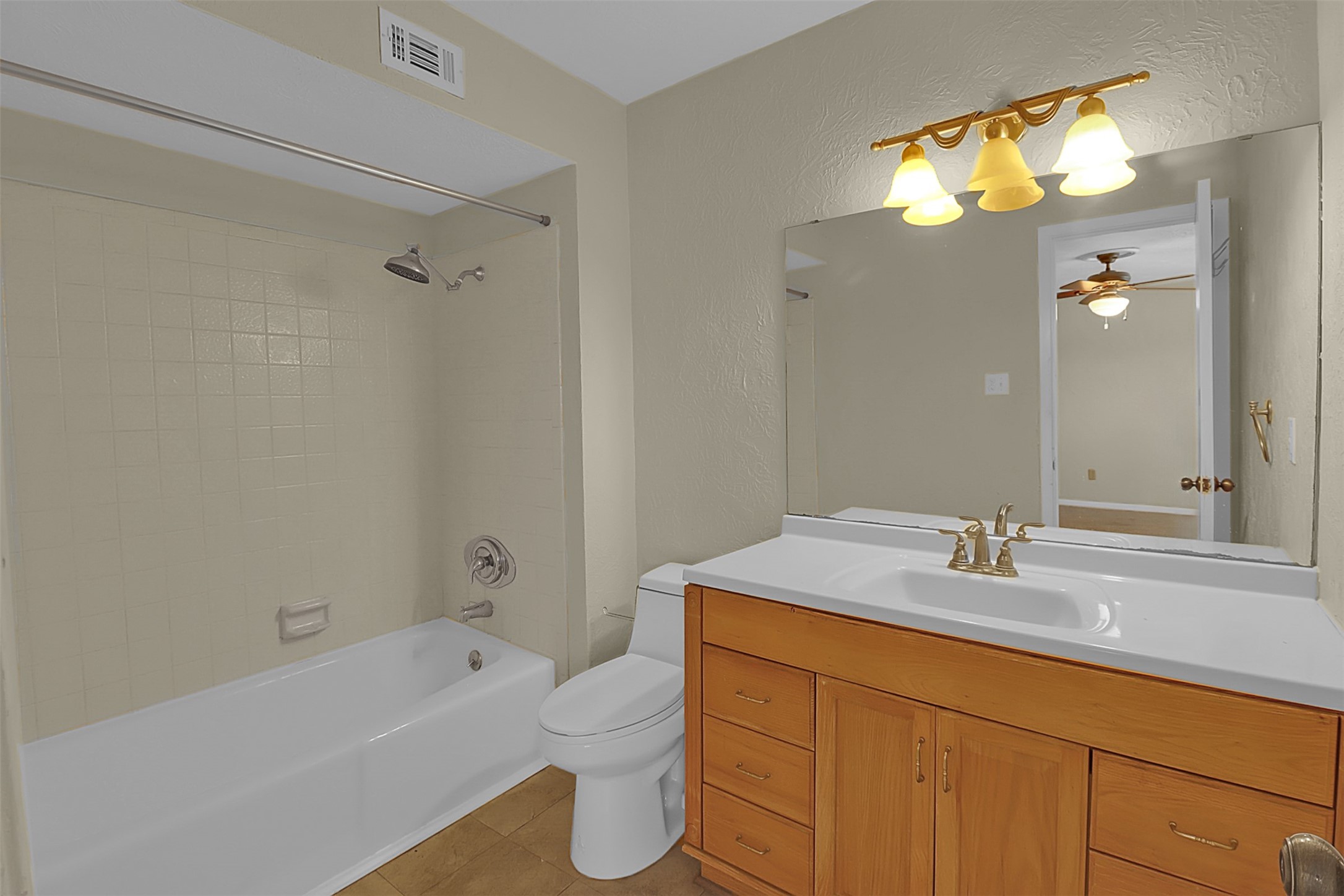 1304 Ward Road, Unit 5 Baytown, TX 77520 - Photo 11 of 19 a bathroom with a sink toilet vanity and tub