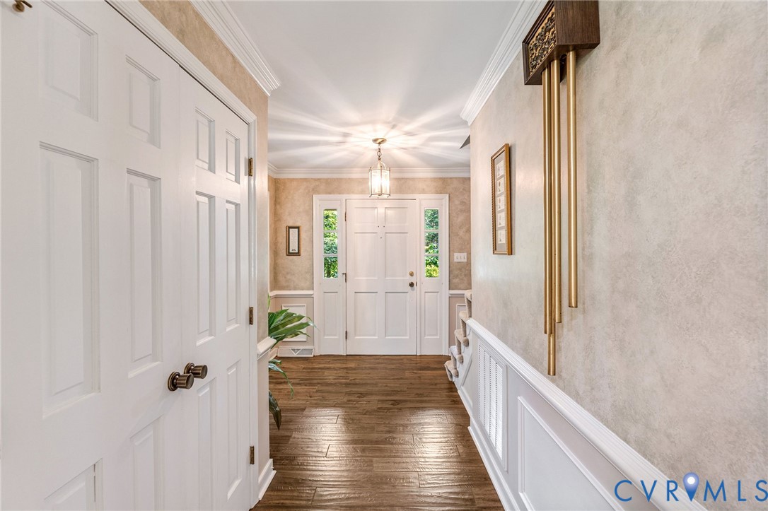 5700 Elfinwood Road Chester, VA 23831 - Photo 6 of 38 a view of a hallway with wooden floor and staircase