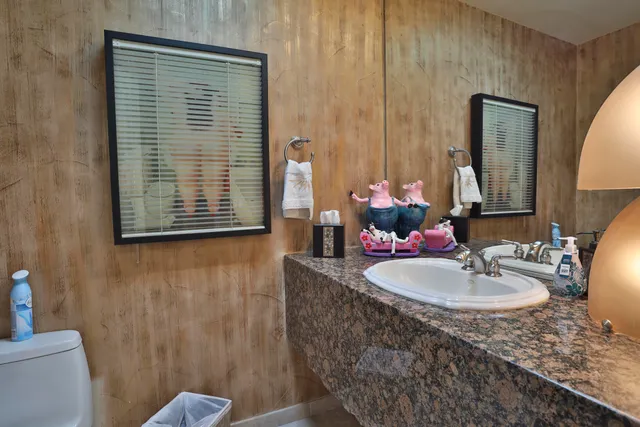 a large kitchen with granite countertop cabinets and a sink