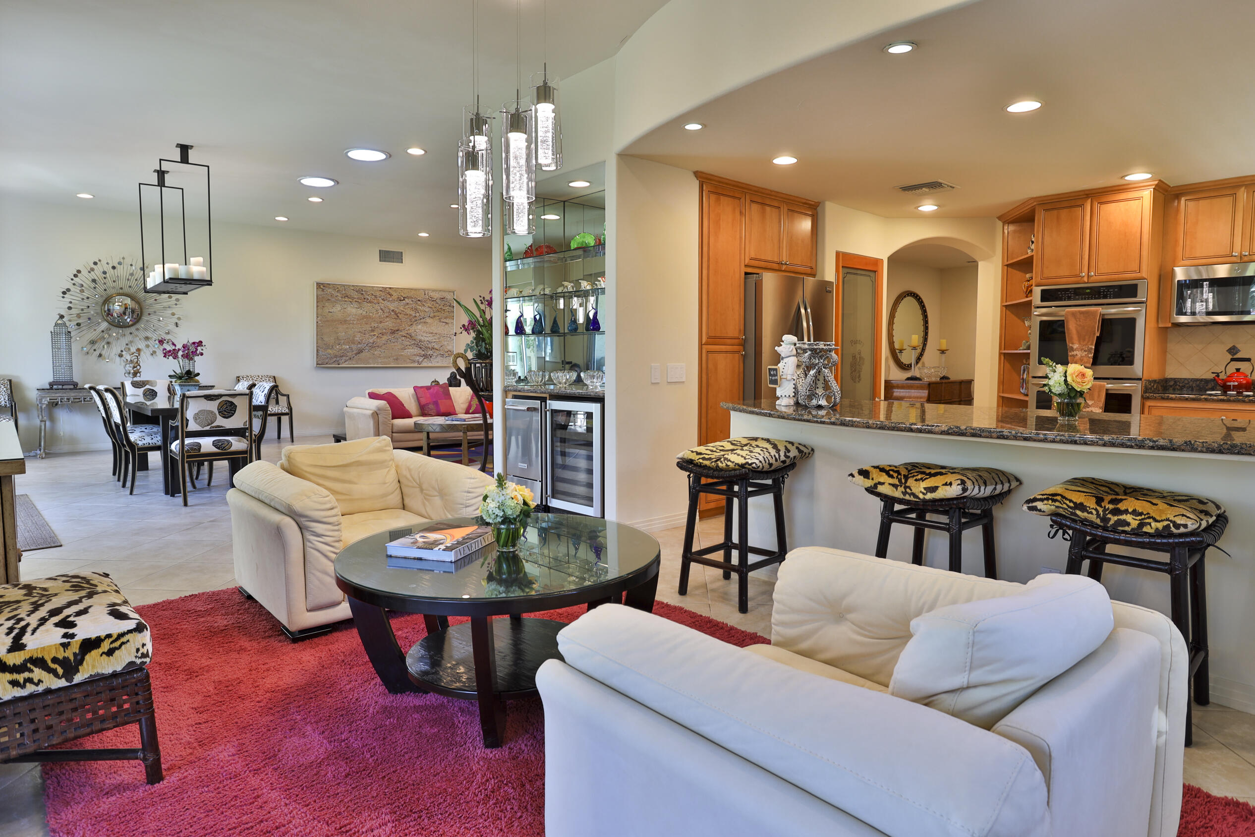 45735 Pawnee Road Indian Wells, CA 92210 - Photo 29 of 74 a living room with furniture kitchen view and a large window