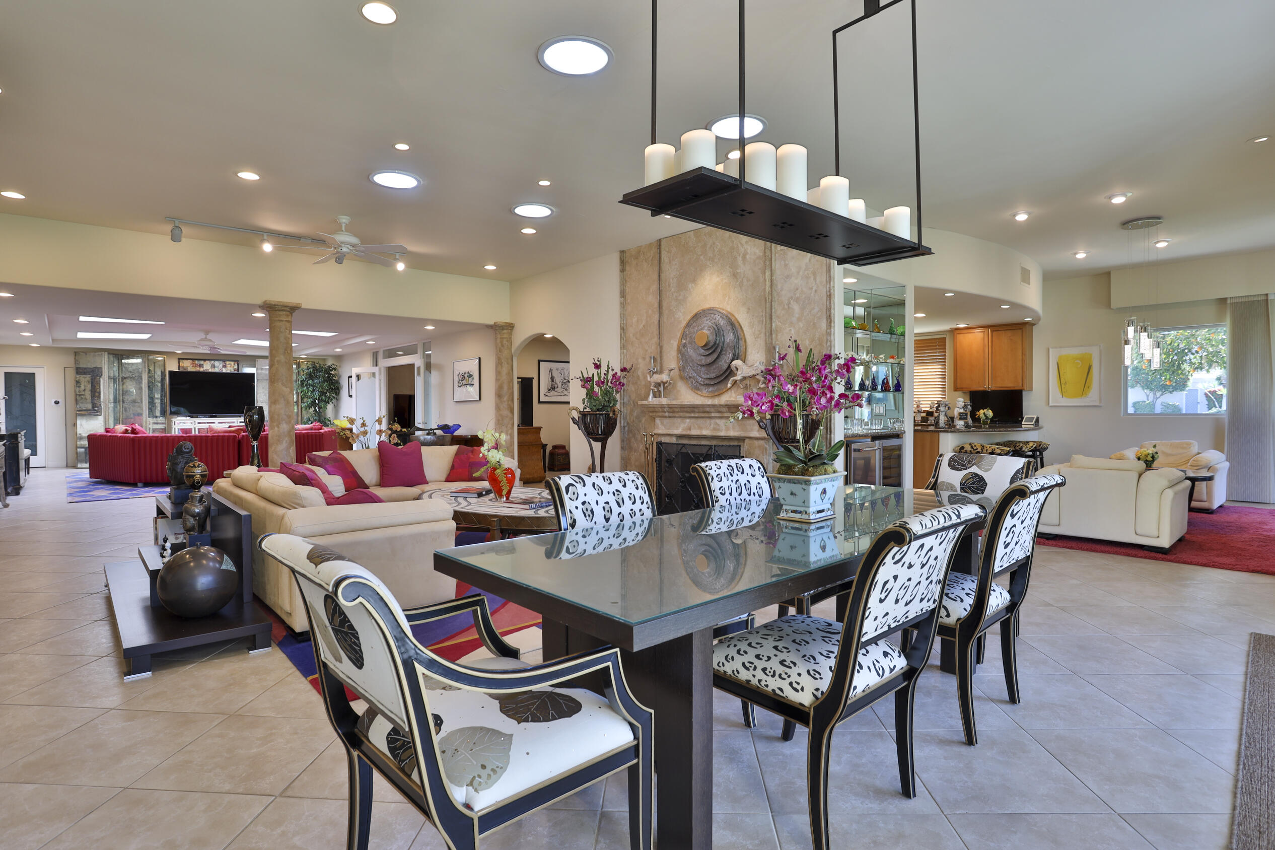 45735 Pawnee Road Indian Wells, CA 92210 - Photo 35 of 74 a living room with dining room and a chandelier