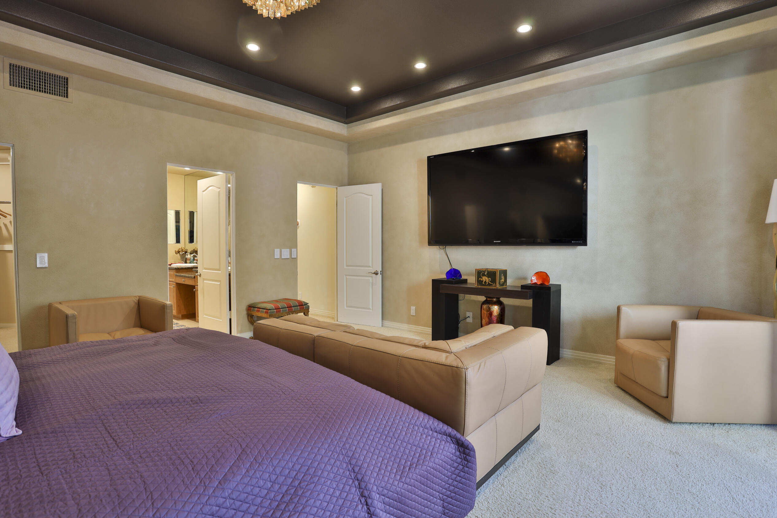 45735 Pawnee Road Indian Wells, CA 92210 - Photo 42 of 74 a bedroom with a bed and a flat screen television