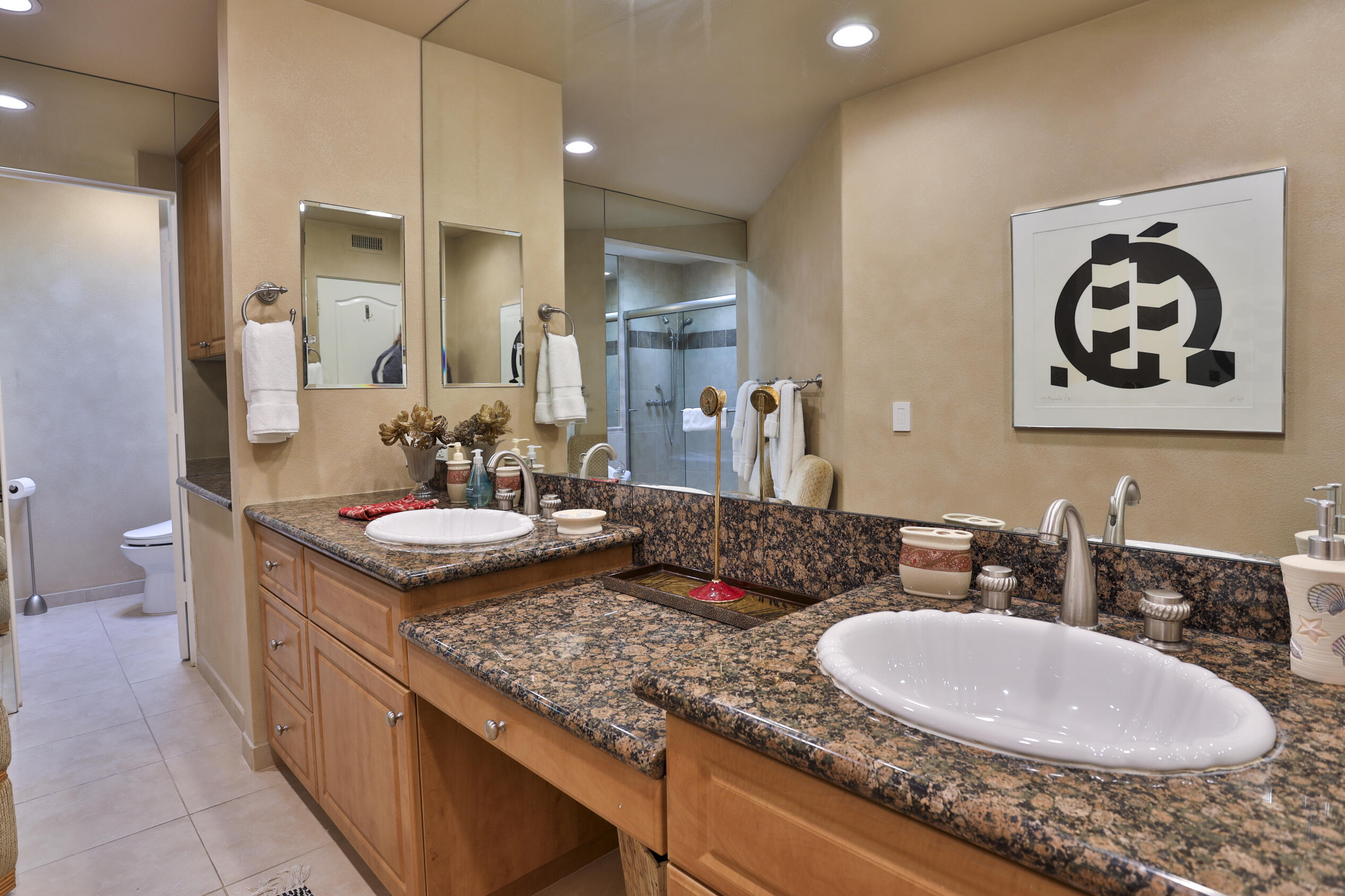 45735 Pawnee Road Indian Wells, CA 92210 - Photo 46 of 74 a bathroom with a granite countertop sink and a mirror