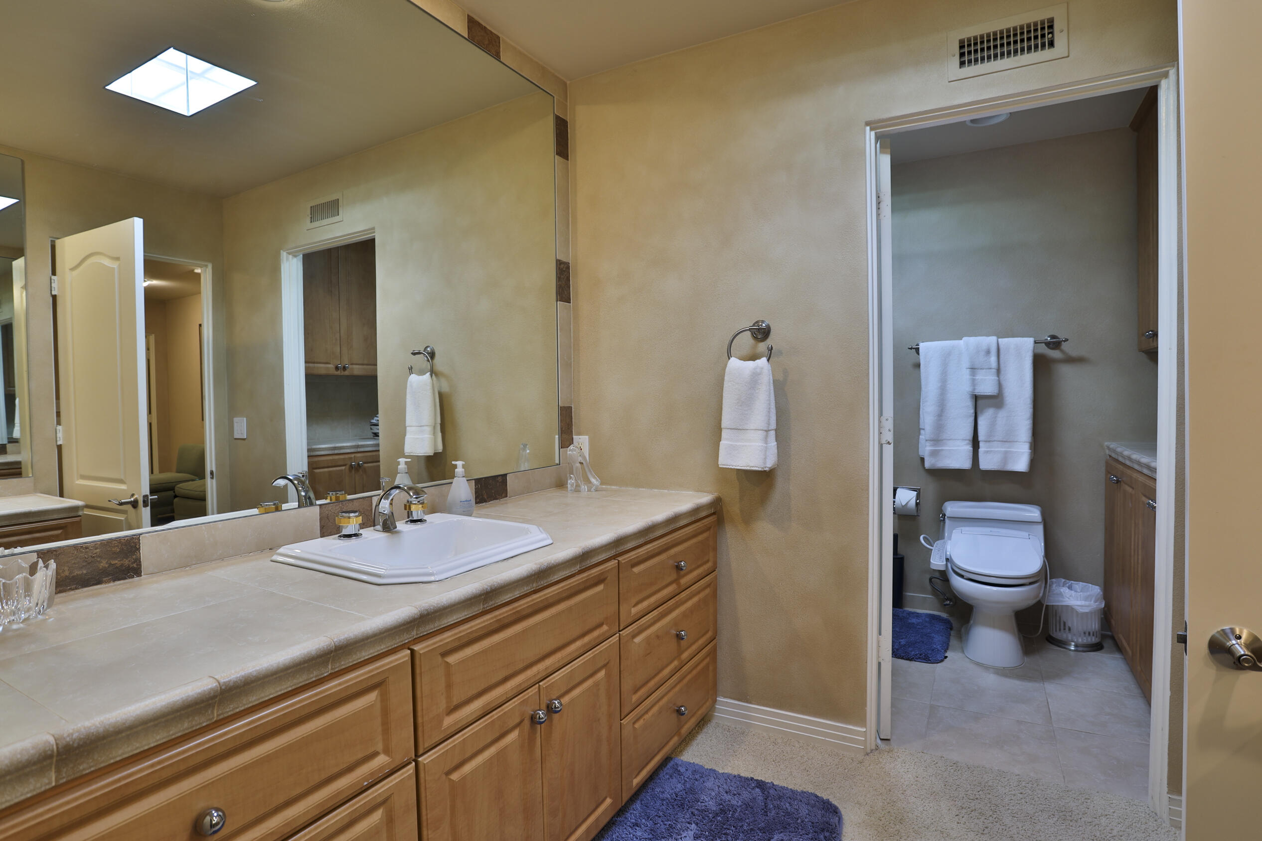 45735 Pawnee Road Indian Wells, CA 92210 - Photo 56 of 74 a bathroom with a sink a toilet and a mirror