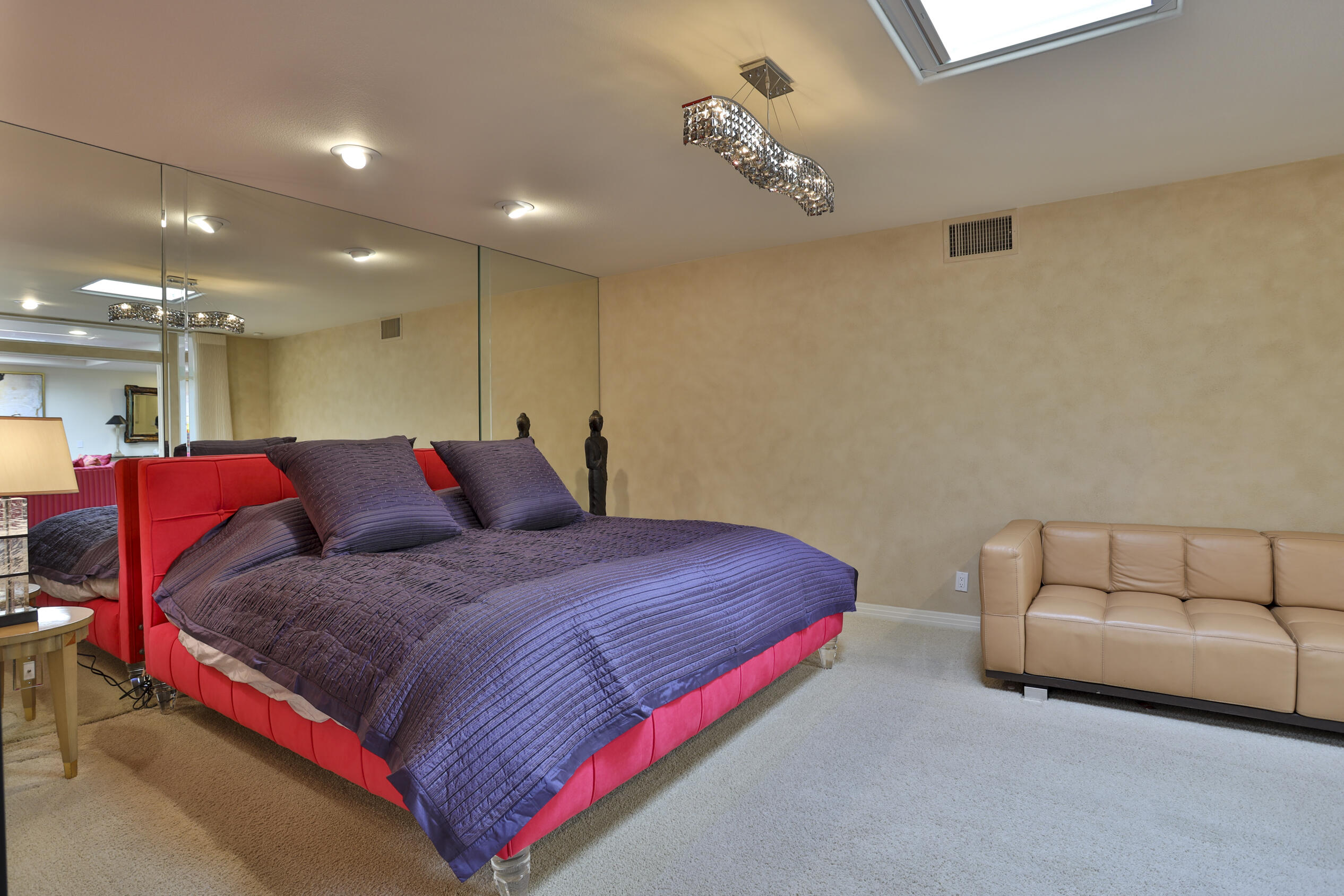 45735 Pawnee Road Indian Wells, CA 92210 - Photo 60 of 74 a bedroom with a bed and a couch