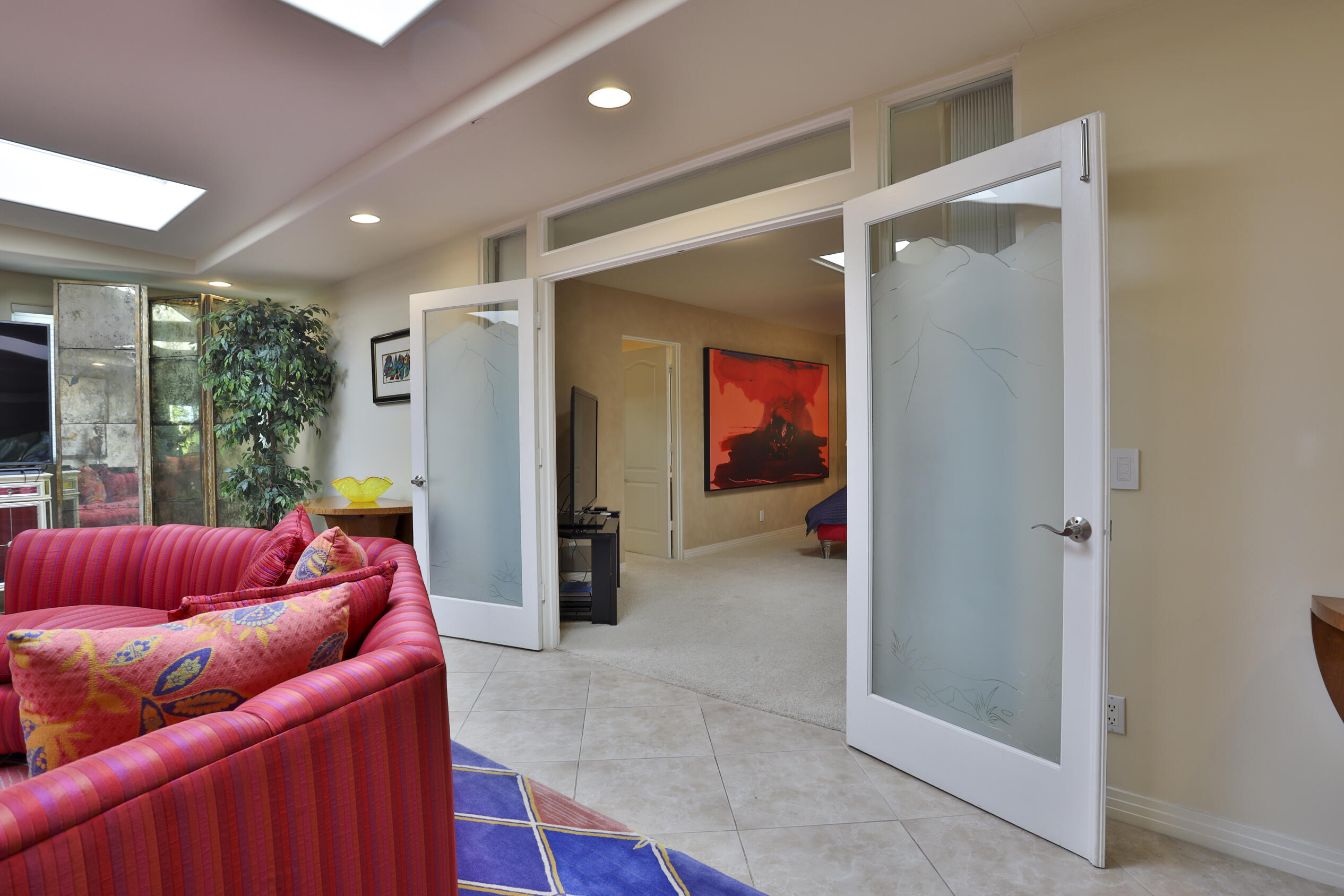 45735 Pawnee Road Indian Wells, CA 92210 - Photo 65 of 74 a living room with furniture and a glass door