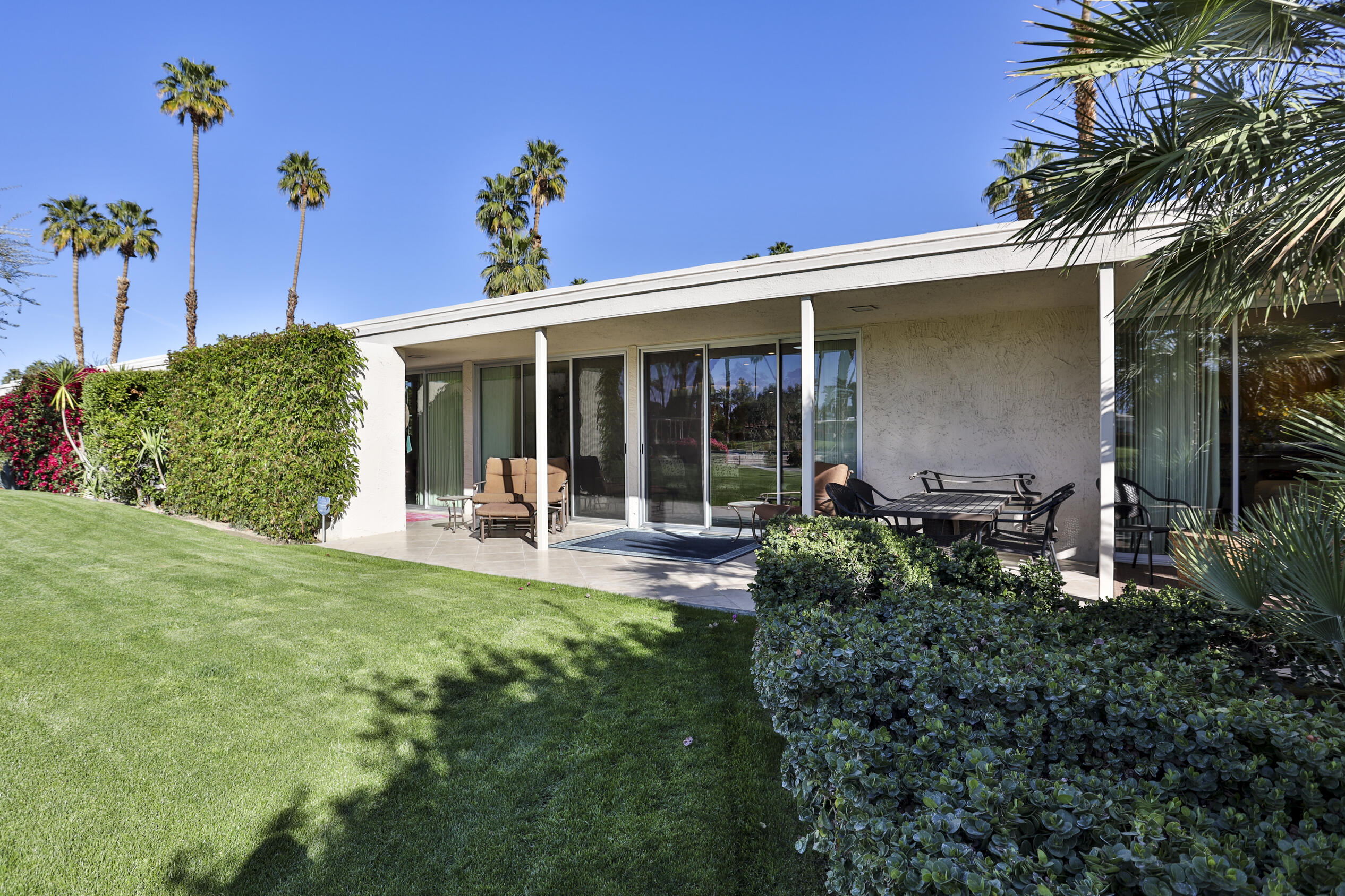 45735 Pawnee Road Indian Wells, CA 92210 - Photo 69 of 74 a view of a house with backyard porch and sitting area