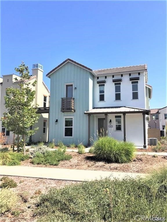 125 Fixie Irvine, CA 92618 - Photo 1 of 28 a front view of a house with a yard