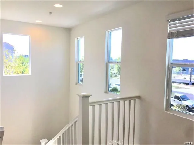 a view of hallway with windows
