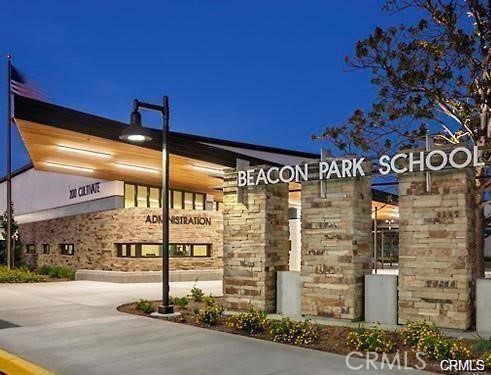125 Fixie Irvine, CA 92618 - Photo 27 of 28 a view of a brick wall with a building in the background
