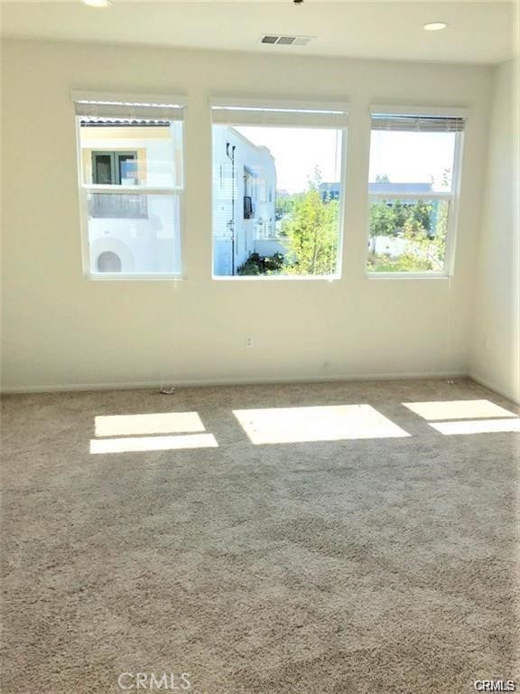 125 Fixie Irvine, CA 92618 - Photo 8 of 28 an empty room with wooden floor and windows