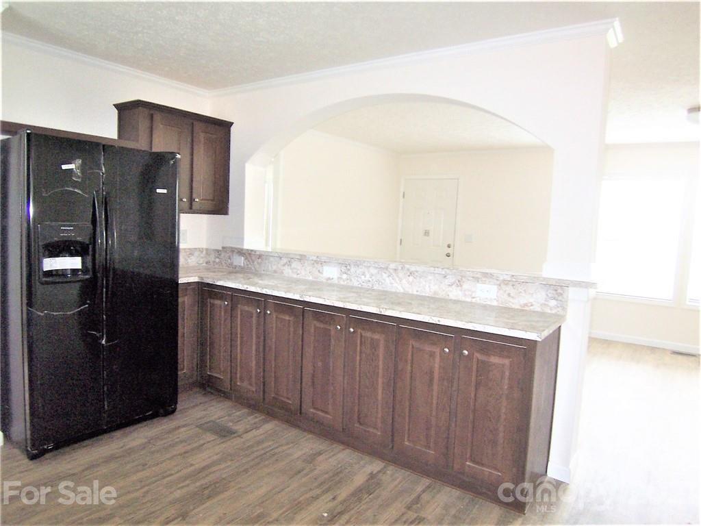 3808 Fallston Road Shelby, NC 28150 - Photo 8 of 18 a kitchen with stainless steel appliances granite countertop a refrigerator and a sink