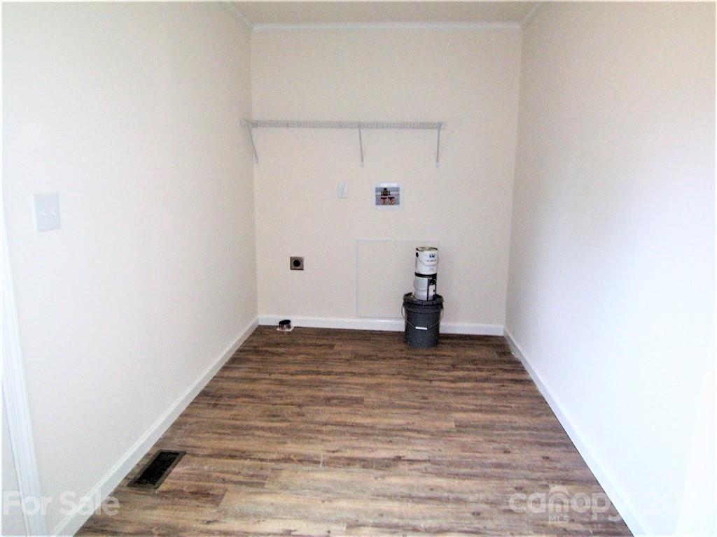 3808 Fallston Road Shelby, NC 28150 - Photo 9 of 18 a view of a room with an empty space and wooden floor