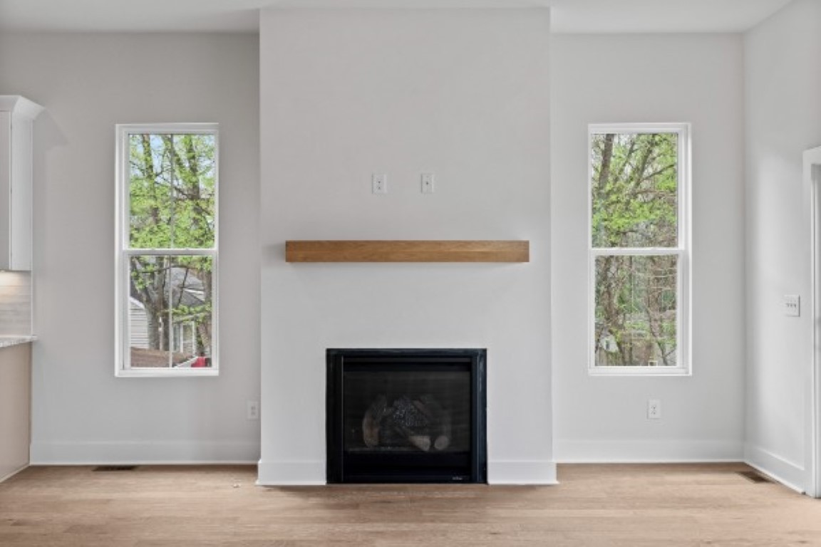 603 Morrow Road, Unit A Nashville, TN 37209 - Photo 11 of 38 a living room with a fireplace and windows