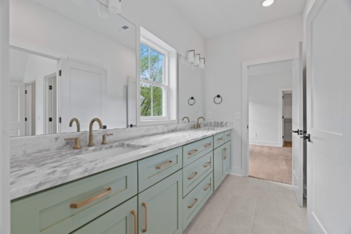 603 Morrow Road, Unit A Nashville, TN 37209 - Photo 31 of 38 a bathroom with double sink and a mirror