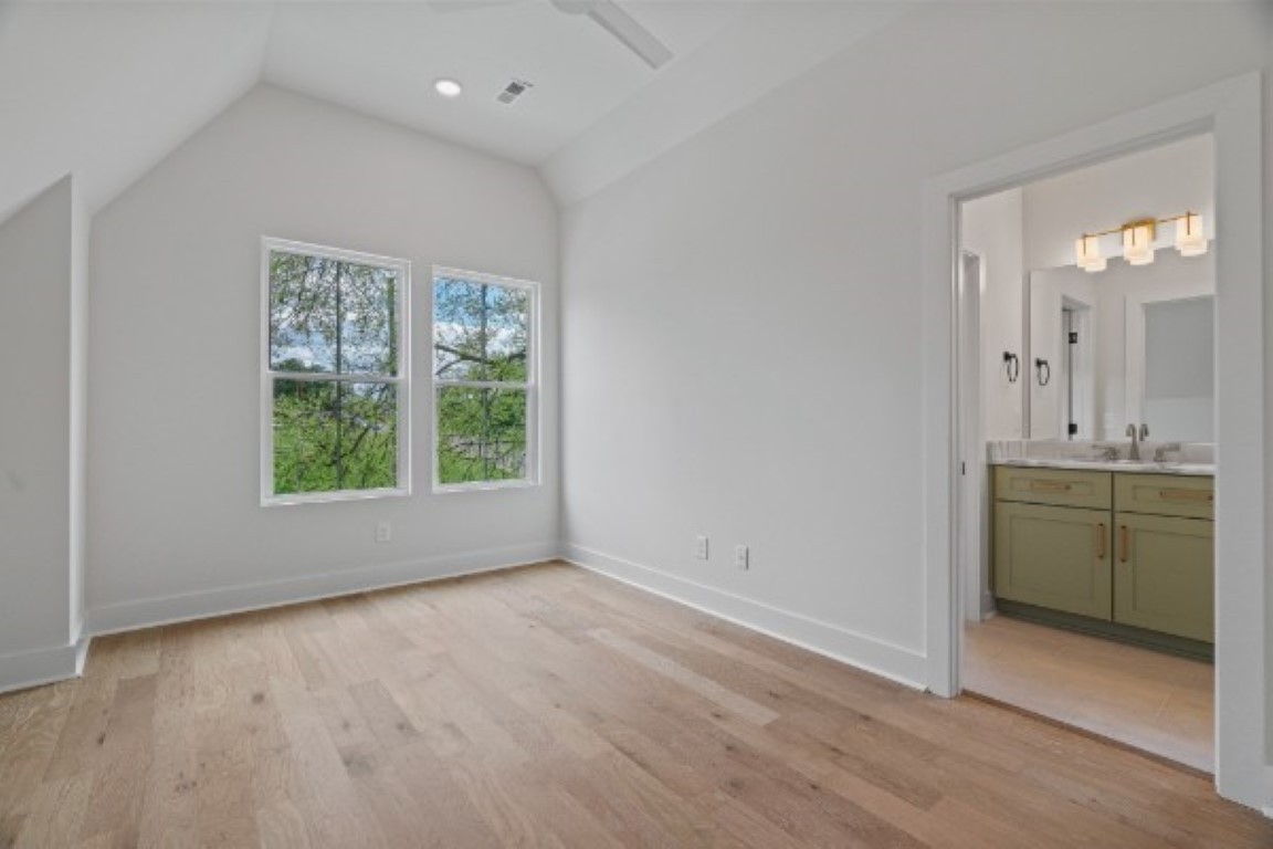 603 Morrow Road, Unit A Nashville, TN 37209 - Photo 32 of 38 an empty room with a sink and a mirror