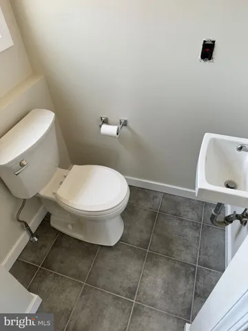 a bathroom with a toilet and a sink