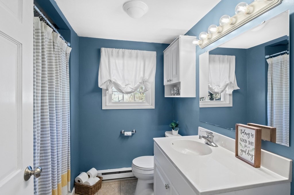 93 Palmer Road Plymouth, MA 02360 - Photo 13 of 34 a bathroom with a toilet a sink and a mirror