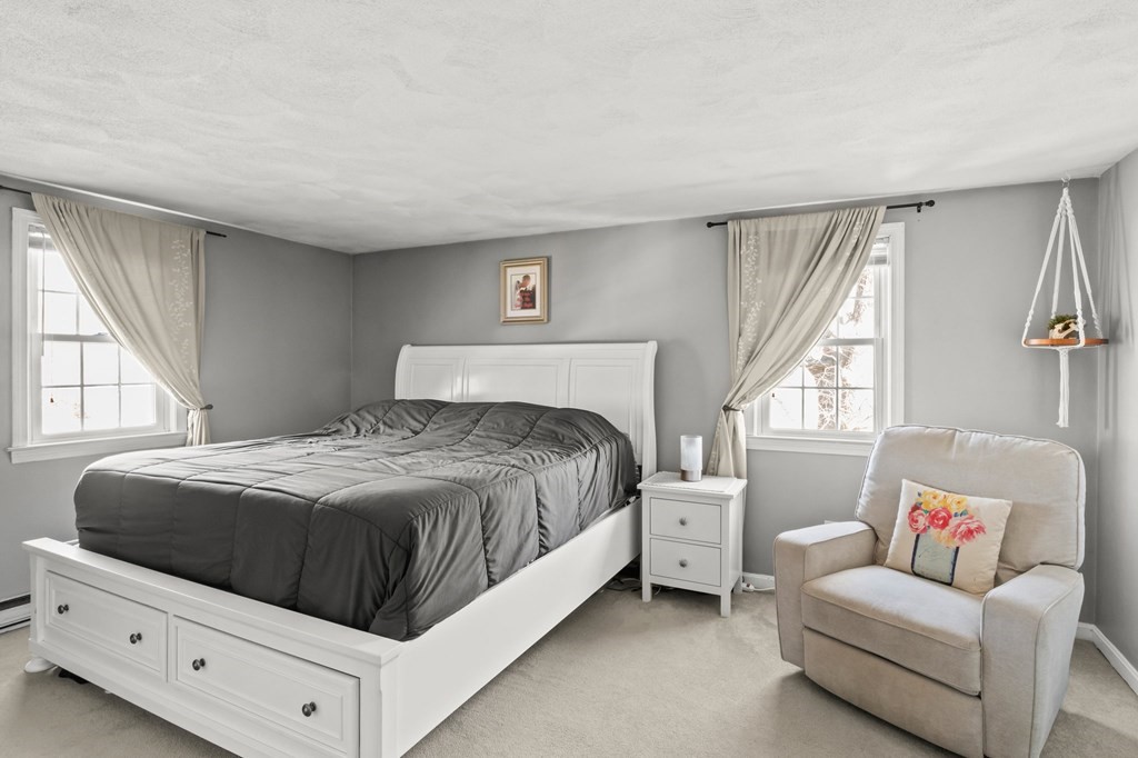 93 Palmer Road Plymouth, MA 02360 - Photo 14 of 34 a spacious bedroom with a bed and a couch
